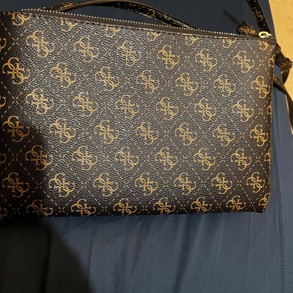 Guess Black and Gold Crossbody Bag with Logo Pattern